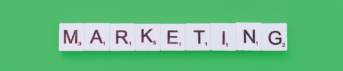 scrabble tiles spelling out "marketing"
